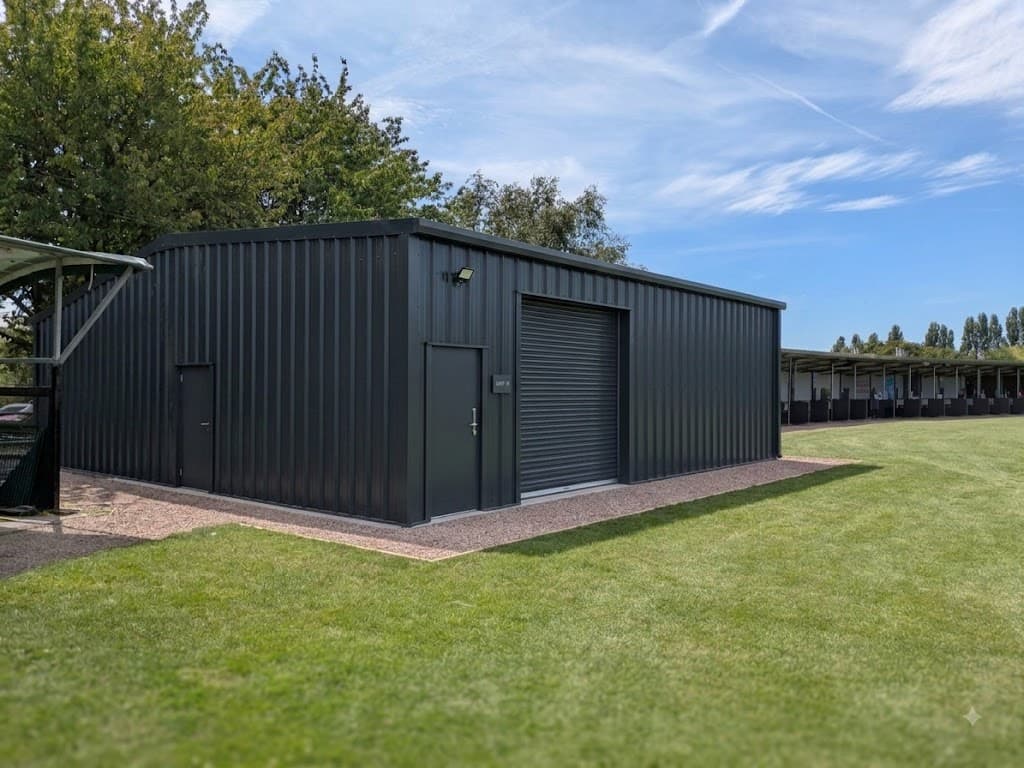Secure anthracite insulated machinery storage shed for golf course groundskeeping equipment